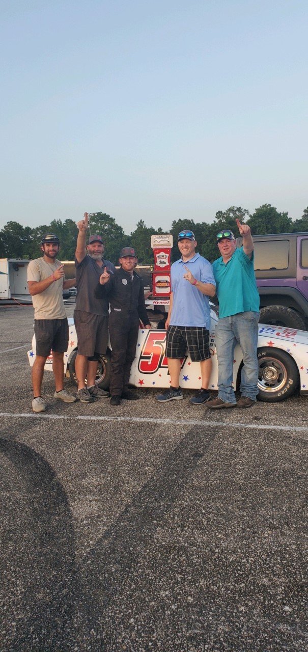 Ty Hymel stands with the rest of the TGH racing crew after his win in the NASCAR Advanced Auto Parts Weekly Series on July 17, 2021.